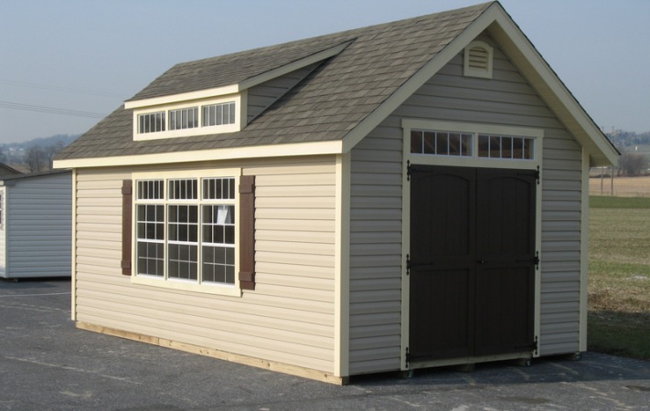 Cambridge-Light brown shed with shingle roof