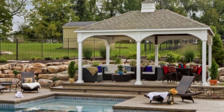 Backyard Entertainment Structures for Outdoor Living Custom backyard entertainment structure with outdoor seating and landscaped gathering area.